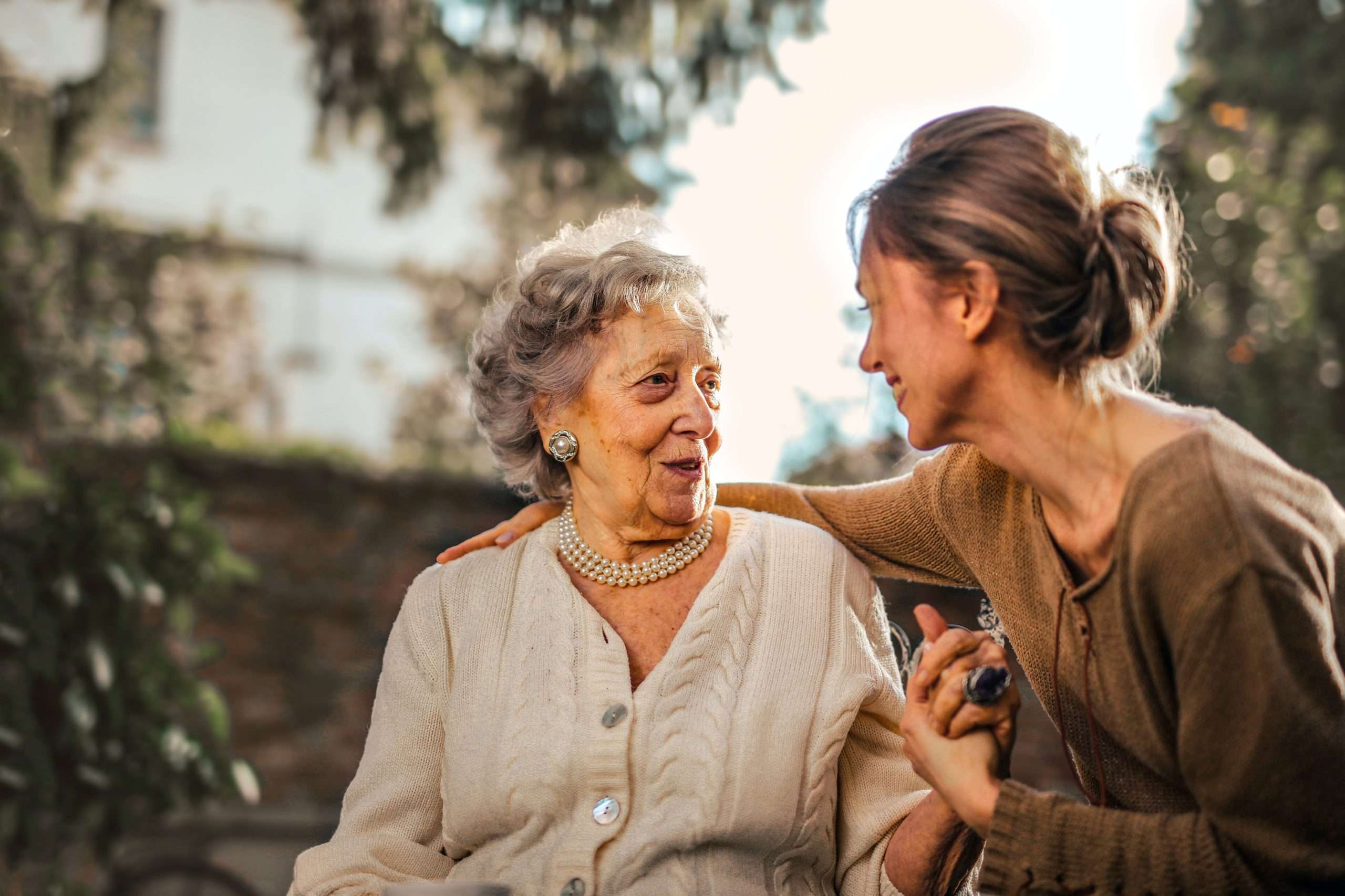 This photo shows a young woman taking care of the older woman.